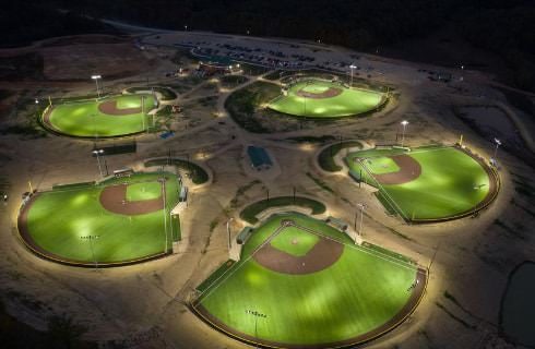 Aerial view of five baseball parks at night